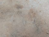 a close up of a dirty floor with dirt on it