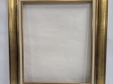a gold picture frame with a white background and a white background