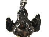 a statue of a bird that is sitting on top of a table