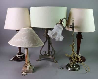 three lamps are sitting on a table with a lamp shade on them