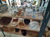 a shelf with a lot of dishes and bowls on it