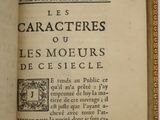 an open book with a picture of a cat on it