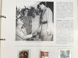 an old photo of a man and woman shaking hands in front of a stamp album
