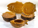 five pieces of pottery that are sitting on a table