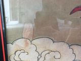 a picture of a window with a picture of a bird on it