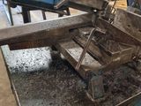 a picture of a machine that is working on a piece of metal