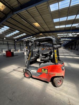 an image of a forklift truck parked in a warehouse