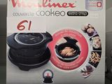une boîte sur laquelle est représenté un poulet en train de cuire