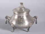 a large silver pot with a lid on a stand