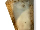 a picture of a piece of glass on a white surface