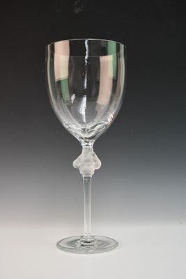 a wine glass that is sitting on a table