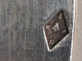 a close up of a piece of metal with a hole in it
