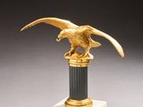 an image of a statue of an eagle on a pedestal