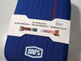 a blue suitcase with a tag on it sitting on a table