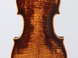 an old violin with a wooden back and a long neck