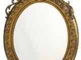 an ornate gold framed mirror on a white background
