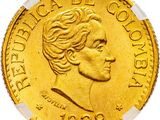 gros plan d'une pièce d'or sur fond blanc