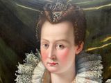portrait of a woman in a white dress wearing a tiable