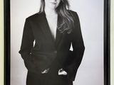 black and white photograph of a woman in a suit posing for a picture