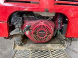 a close up of a red engine on a red truck