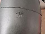 a close up of a pair of black leather boots with a zipper