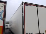 two trucks that are parked next to each other in a parking lot