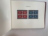 a book with a picture of two stamps on it