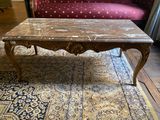 a coffee table on a rug in a living room