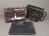 three purses that are sitting on a table