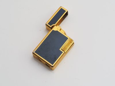 a close up of a lighter on a table with a white background