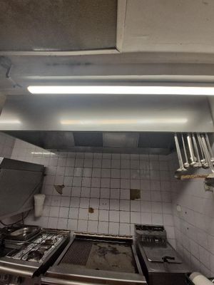 a kitchen with a stove, oven, and microwave in it