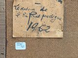 an old piece of paper with writing on it sitting on a piece of wood