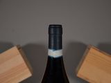 a bottle of wine that is sitting on a table