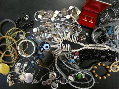 many different types of jewelry on the table