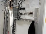 a room with a lot of wires on the wall
