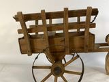 an old wooden wagon with a wooden seat and wheels on a white background