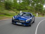 the mercedes sls amg coupe driving on a road with blurry trees in the background