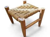 an image of a small stool made out of wood and rope