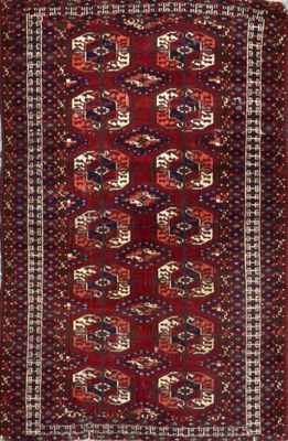 a red and blue rug with geometric design on a white background