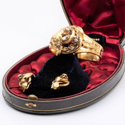 a box with a ring and two other items in it