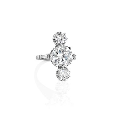 a diamond three - stone ring, by van cleef