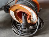 a hose that is sitting on the ground in the garage