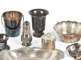 a lot of silver items that are on the table