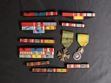 several medals and medals are laid out on a black surface