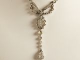 a close up of a necklace on a mannequin mannequin mannequin mannequin mannequin mannequin mannequin mannequin