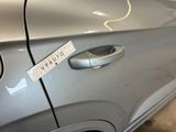 a sticker on the door handle of a car