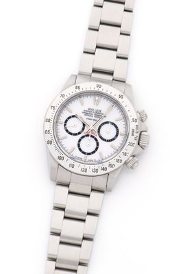 a close up of a watch on a white surface with a white background