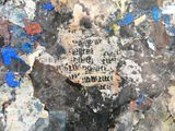 a piece of paper with writing on it on the ground