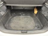 the trunk of a car with the seat folded open