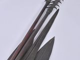 four different types of knives on a white surface